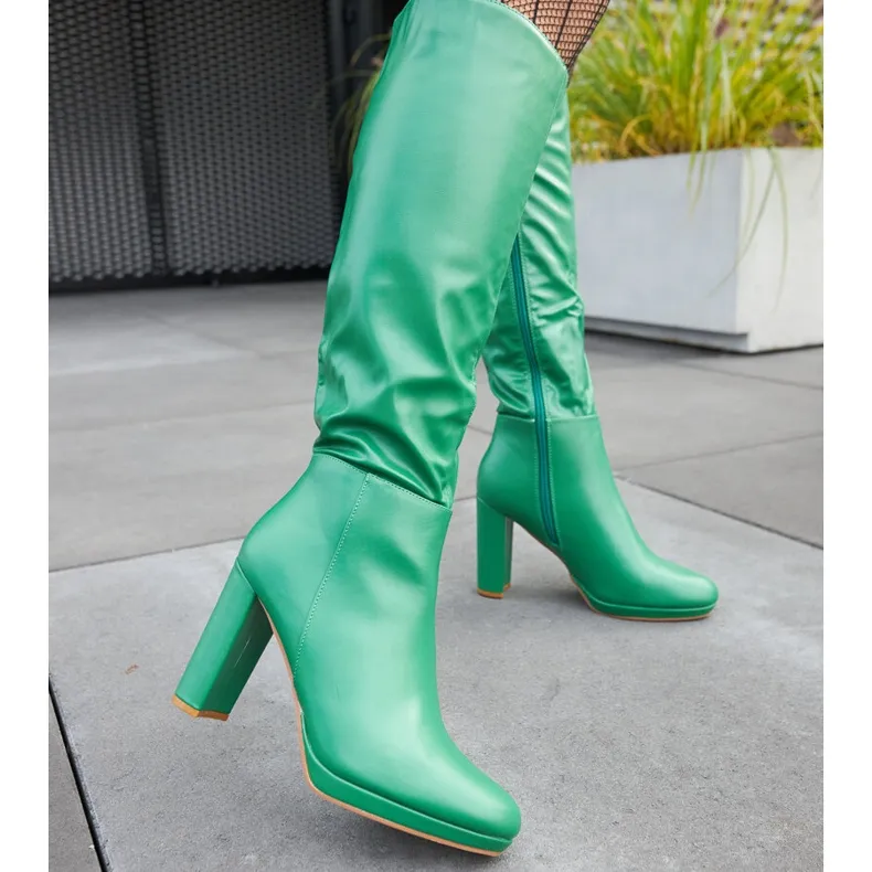 Green high heel boots by Strother