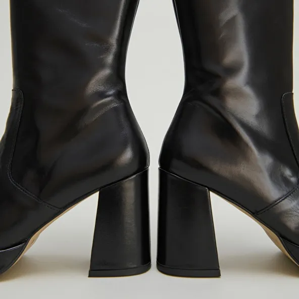 Platform boots in black leather