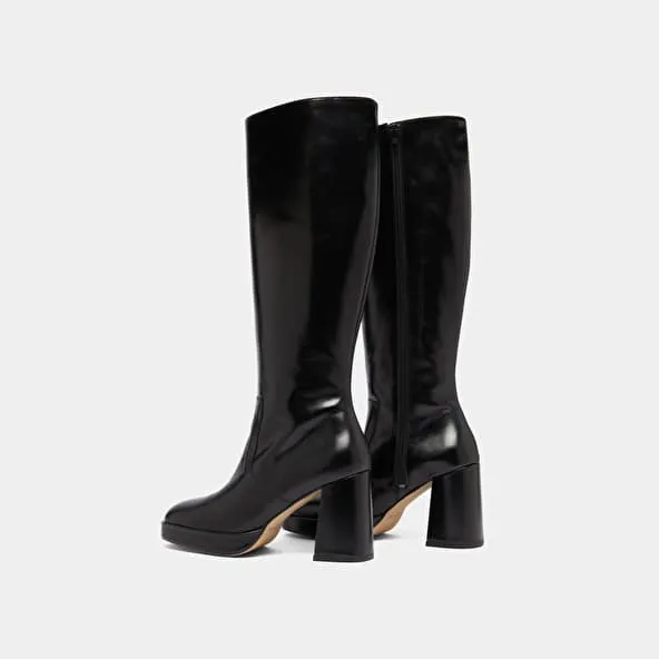 Platform boots in black leather